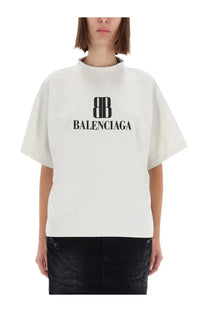 Balenciaga women’s off-white t-shirt with bold black logo printed across the chest in cotton fabric