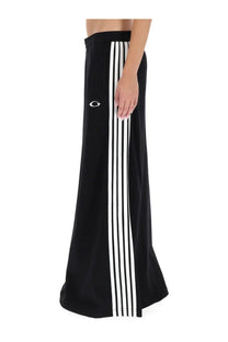 Balenciaga women’s black athletic maxi skirt with three white side stripes and embroidered hip logo for sportswear