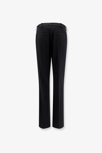 Balenciaga women’s slim tailored wool trousers black shown from the back with straight-leg cut and subtle pleats