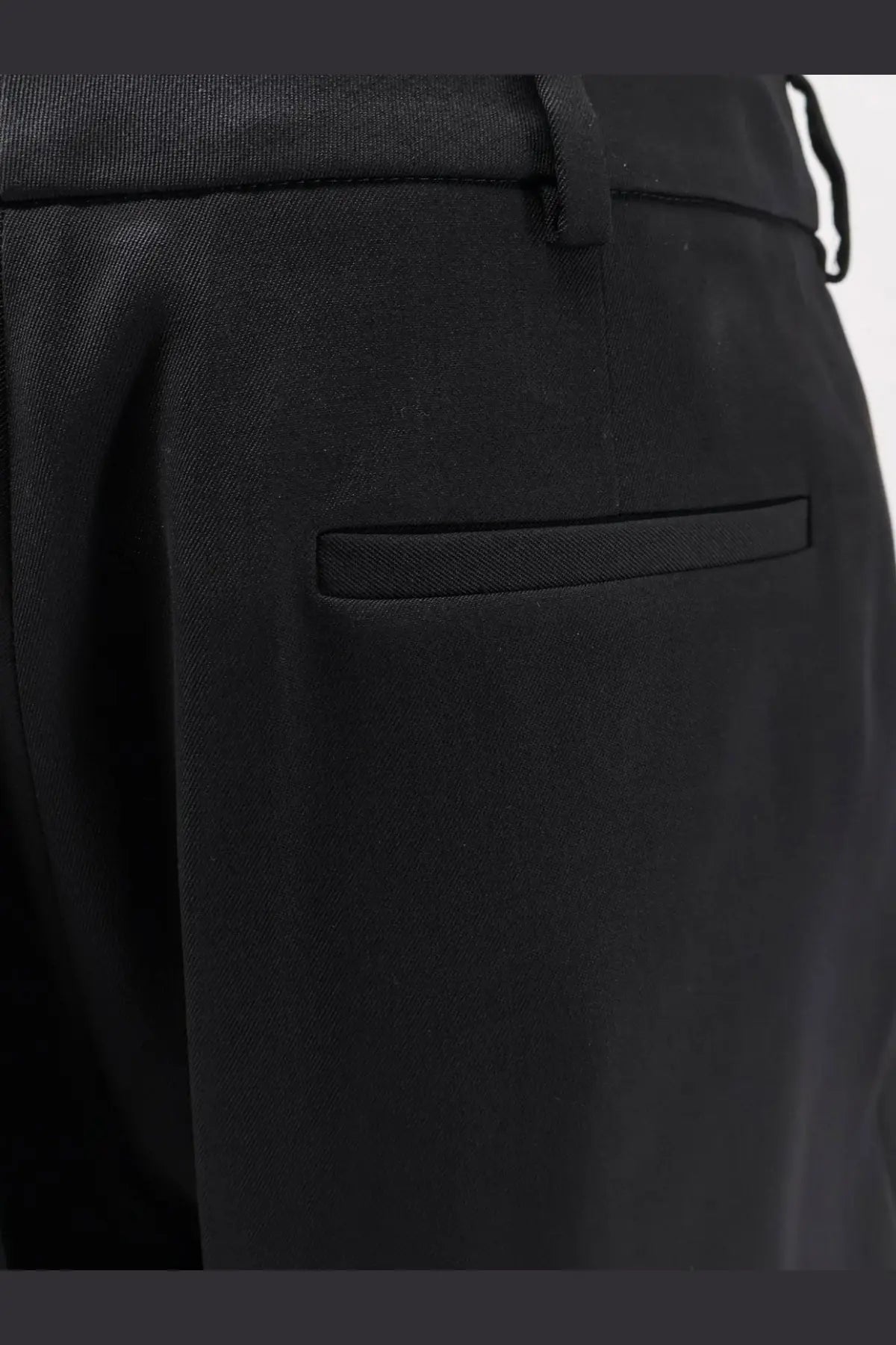 Balenciaga women’s slim tailored black wool trousers with textured fabric subtle pleat and matching belt loop