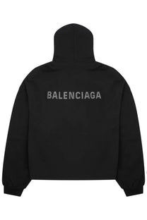 Balenciaga women’s black sweatshirt showing the back with a silver embroidered logo on a hoodie design