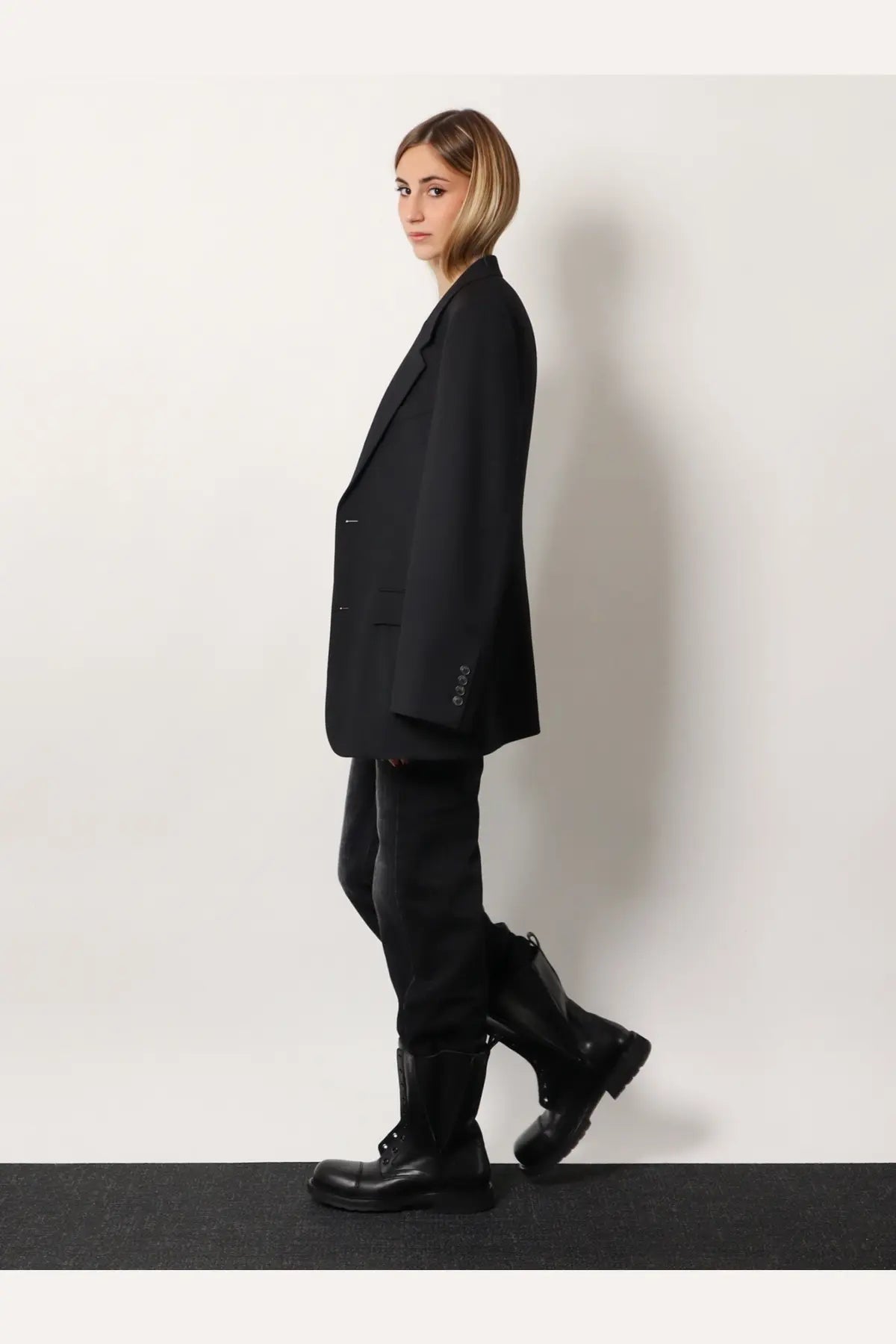 Black oversized blazer with structured silhouette and subtle button detailing from balenciaga women’s tailored standard line