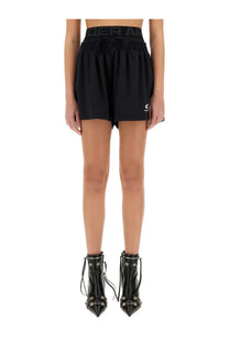 Balenciaga women’s under armour running shorts in black with elastic waistband and subtle logo detailing