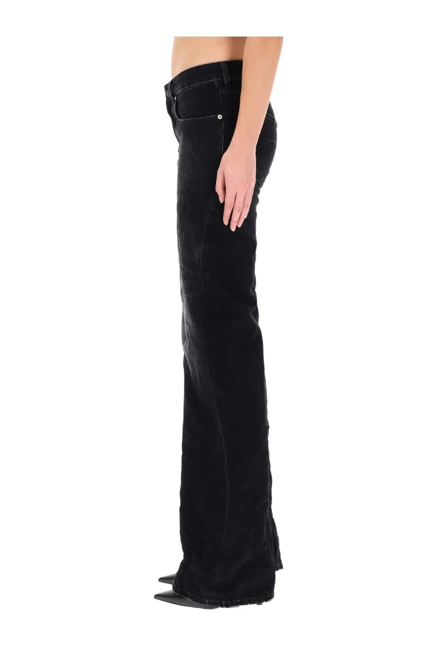 Balenciaga women’s black velvet flare jeans with sleek high-waisted design and subtle stitching details