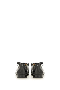 Bally women’s moccasin plume black patent leather loafers with silver-toned studs and classic lace-up design