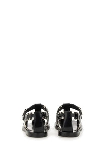 Bally women’s sandal pasely black black patent leather t-strap sandals with silver studs and open toe design
