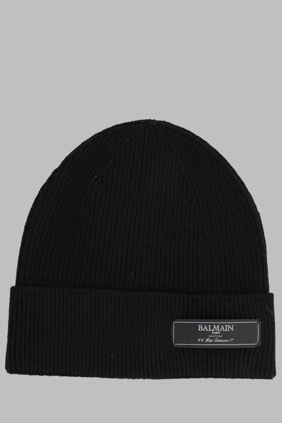 Balmain men’s black ribbed knit beanie with folded cuff and rectangular black label featuring white text