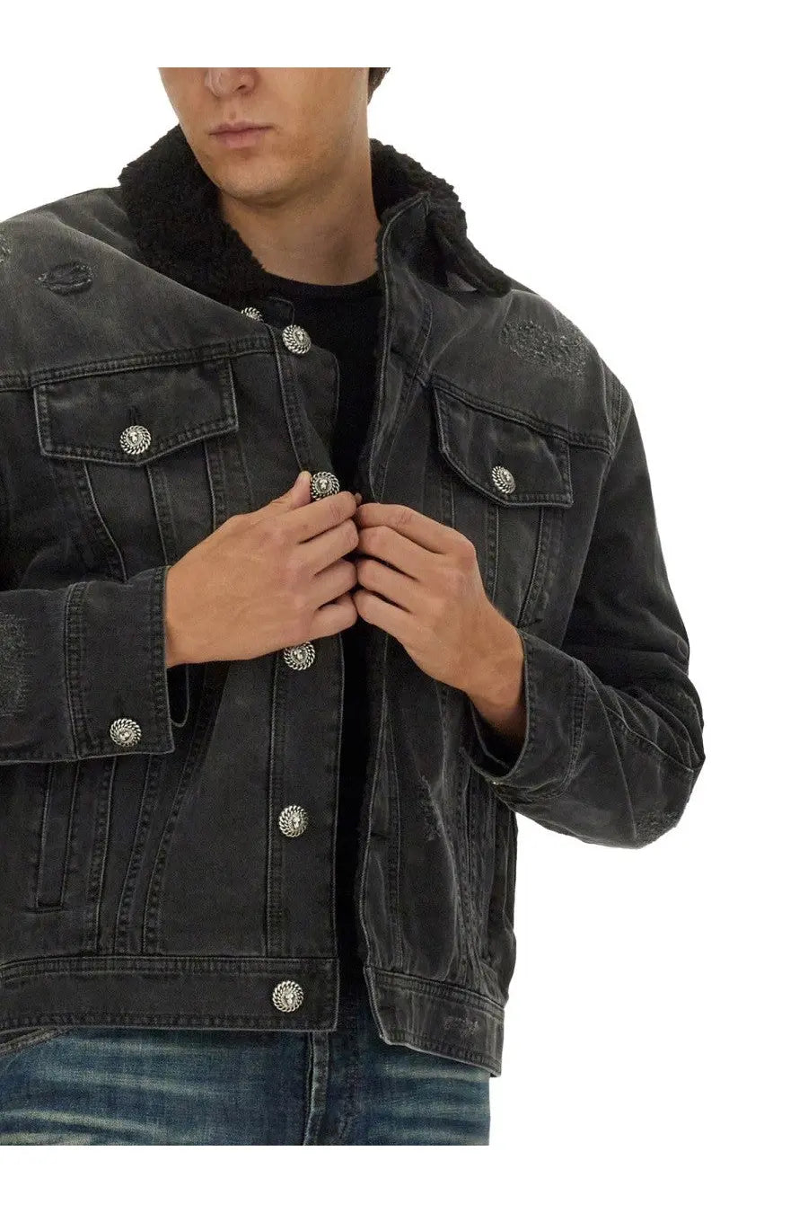 Balmain men’s black distressed denim jacket with silver decorative buttons and plush shearling collar