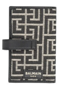 Balmain mens monogram card holder in black and white geometric pattern with leather strap closure