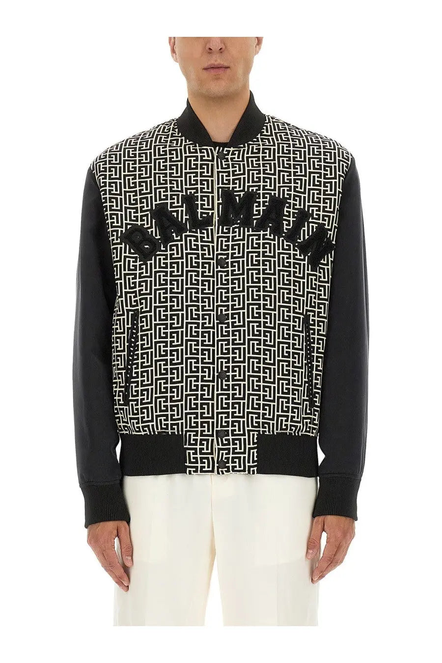 Balmain men’s multicolor bomber jacket with black and white pattern and bold Balmain lettering across the chest