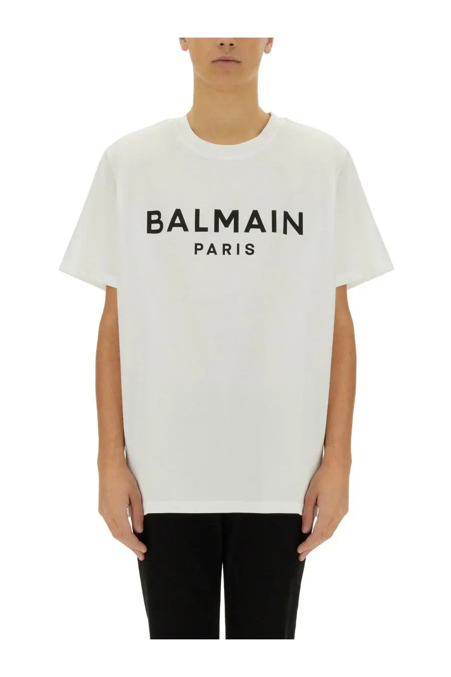 Balmain men’s white t-shirt featuring bold black paris logo lettering across the chest in cotton material