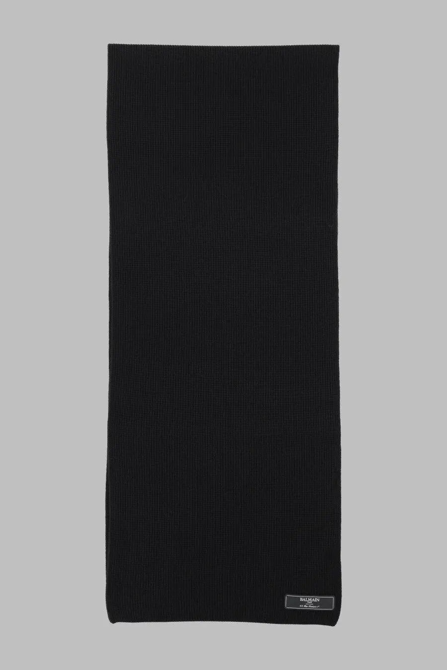 Balmain men’s black ribbed knit scarf made of textile with subtle texture and a small rectangular label at the corner
