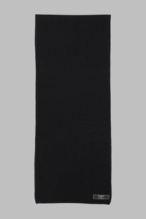Balmain men’s black ribbed knit scarf made of textile with subtle texture and a small rectangular label at the corner