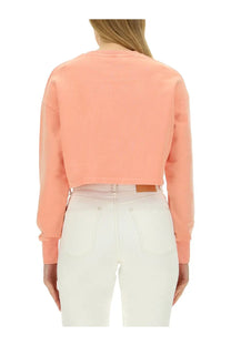 Coral-colored cropped sweatshirt with long sleeves and ribbed cuffs in balmain women’s sweatshirt blue collection