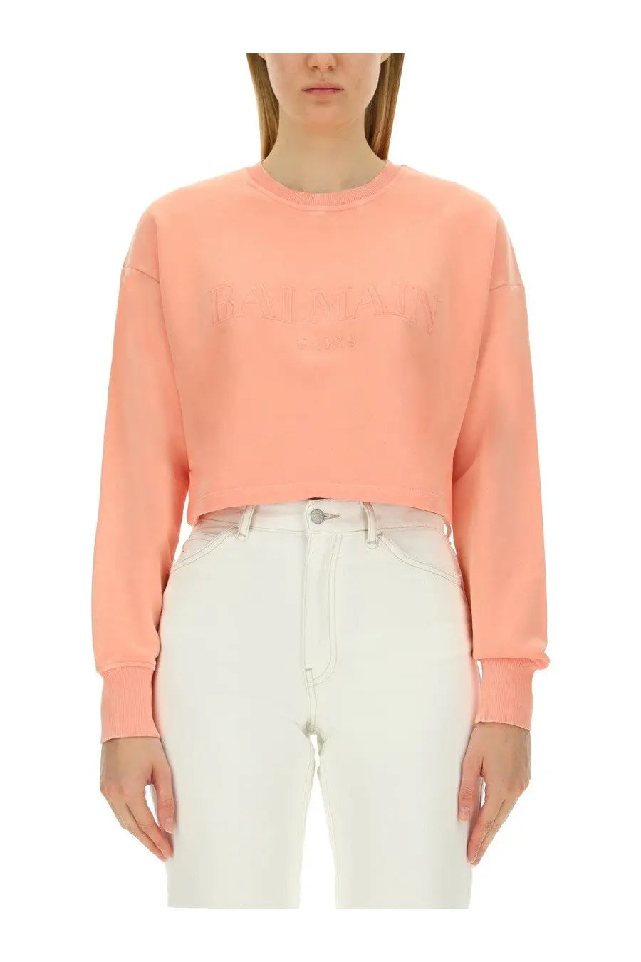 Balmain women’s soft peach-colored cropped sweatshirt with subtle embroidered logo on the chest