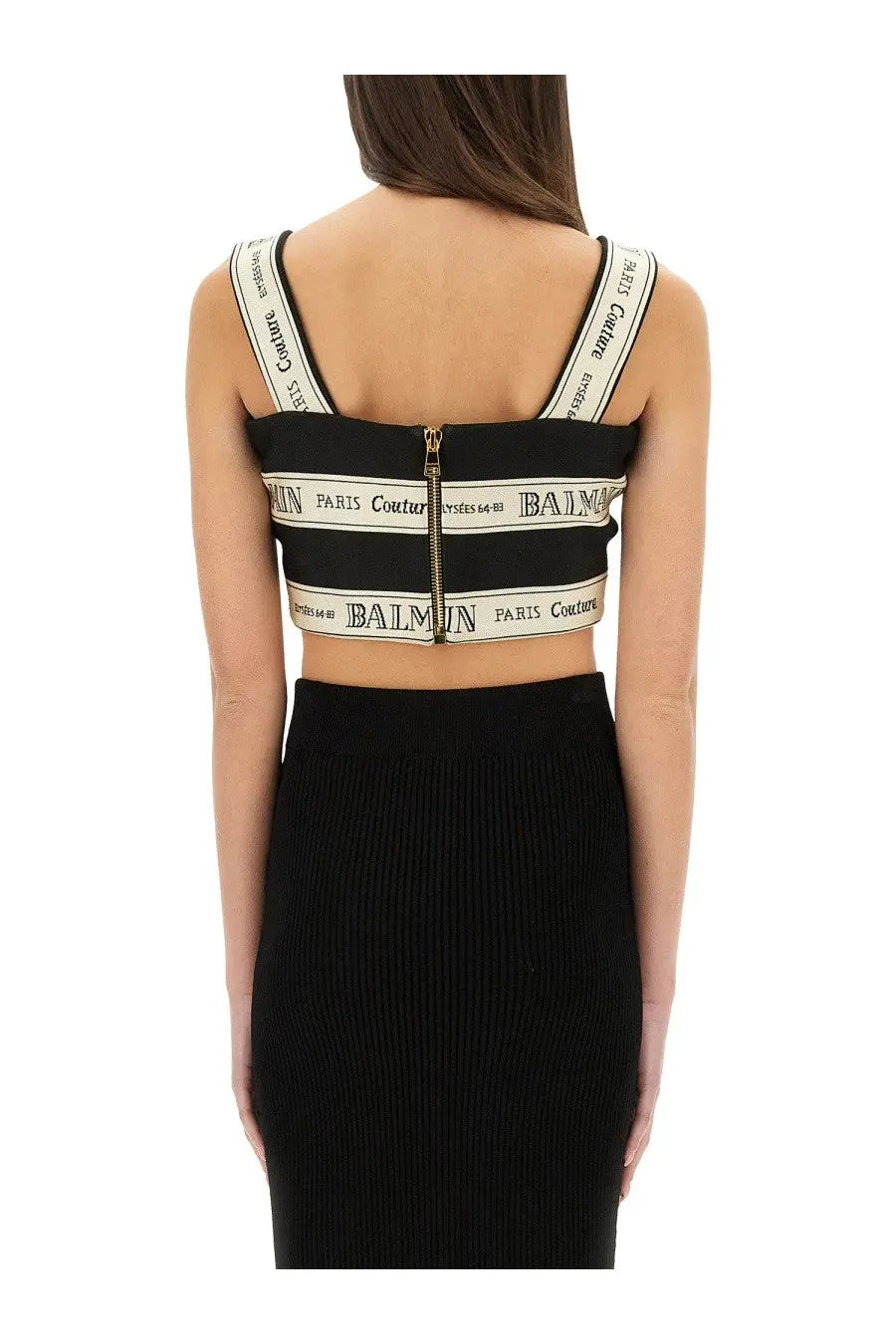 Balmain women’s black crop top with white logo bands and central gold zipper for stylish casual wear