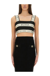 Balmain women’s black crop top with contrasting white ribbed straps featuring logo and paris couture text