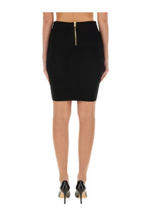 Back view of balmain women’s black high-waisted vichy knit pencil skirt with gold zipper detail