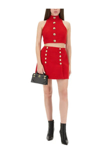 Balmain women’s red wool crop top with gold buttons paired with matching mini skirt featuring double gold buttons