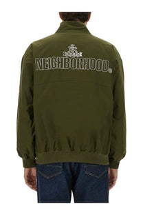 Olive green baracuta men’s bomber jacket with neighborhood lettering and crest logo on the back side