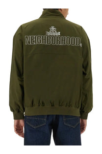 Back view of baracuta men’s olive green bomber jacket featuring white embroidered neighborhood logo and crest