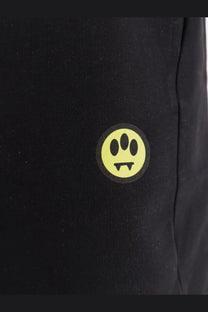 Barrow men’s cotton bermuda shorts black showing bright yellow circular logo with three oval eyes and fangs