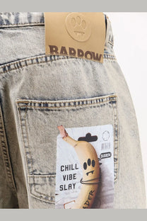 Light-wash barrow men’s cotton jeans in blue with brown leather brand tag and paw print logo on back waistband