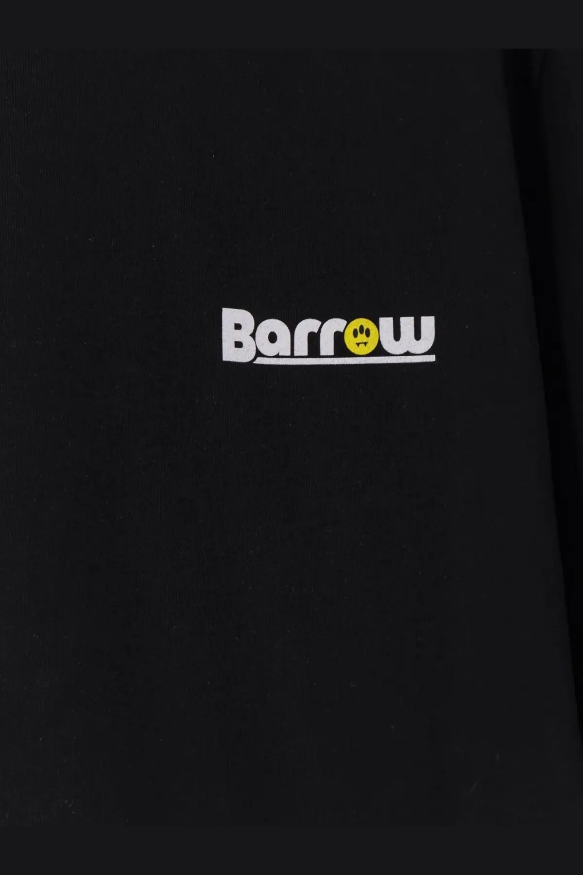 Black cotton barrow men’s shirt featuring a white and yellow logo with a smiling face on the front
