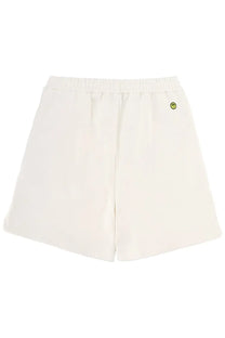 Cream-colored soft cotton barrow unisex bermuda iconic white shorts with elastic waistband and yellow smiley face logo
