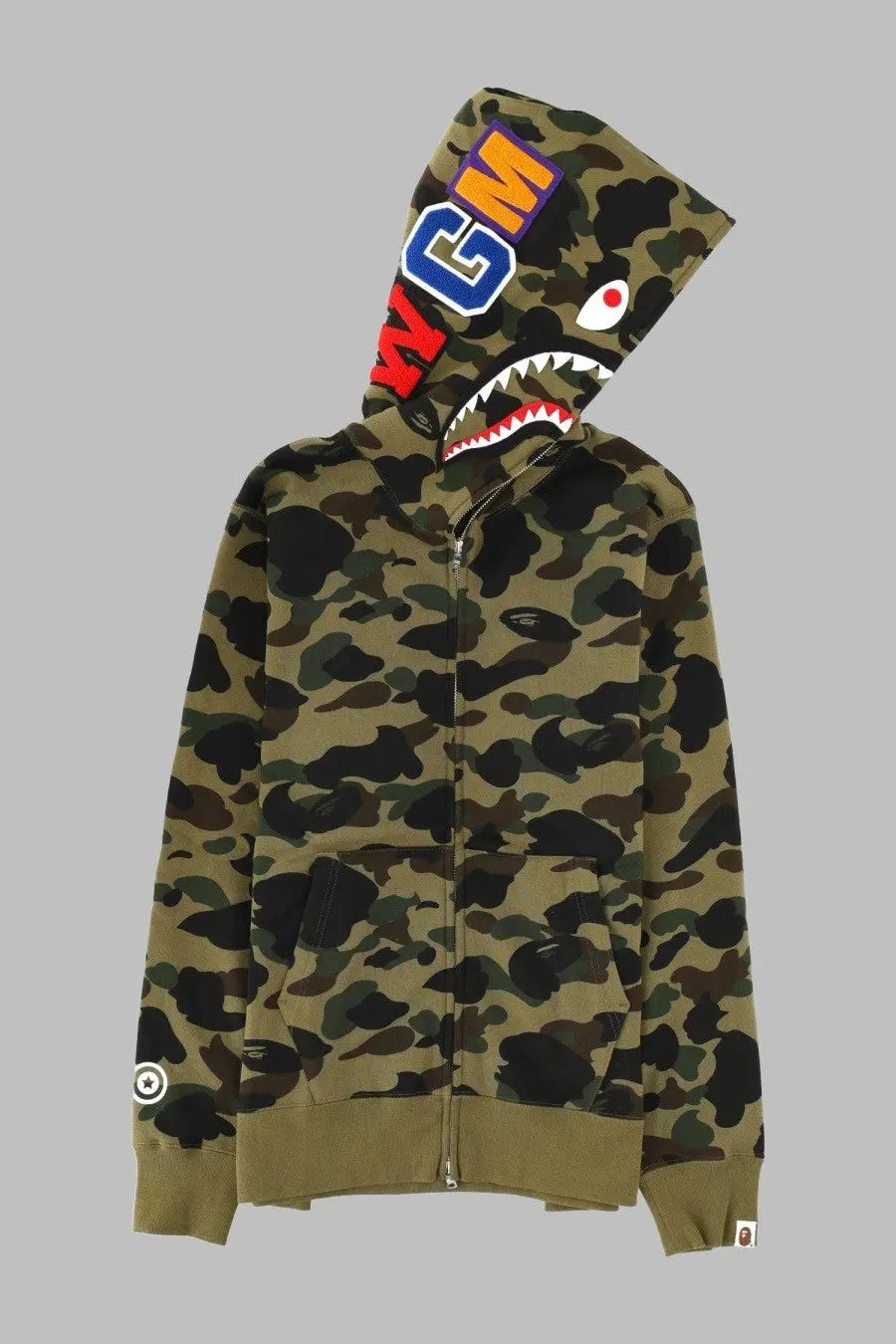 A bathing ape men’s olive green camouflage zip-up hoodie with shark face hood and bold bape lettering