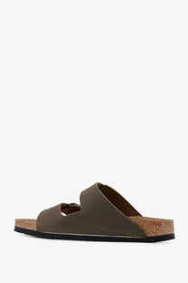 Olive green leather birkenstock arizona sandal with a cork footbed and black rubber sole
