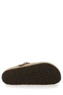 Beige suede birkenstock unisex sabot boston clog with dark brown rubber sole and matching strap shown from the back side
