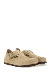 Beige suede birkenstock unisex sabot london clogs with silver buckle and dark brown rubber sole front view
