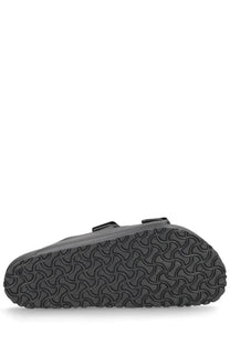 Birkenstock unisex Arizona sandal in black with two adjustable straps and textured rubber sole for comfort and durability