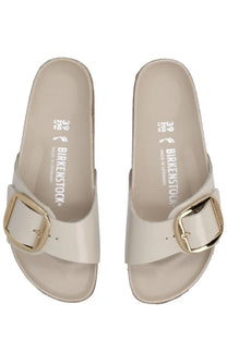 Beige birkenstock unisex sandal madrid with a gold-toned buckle and glossy finish in pink material