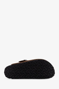 Birkenstock unisex suede boston sandals in brown featuring brown leather clogs with black rubber soles and wavy tread patterns
