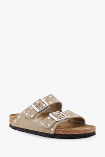 Beige suede birkenstock women’s arizona sandals with silver double buckles and white stud accents