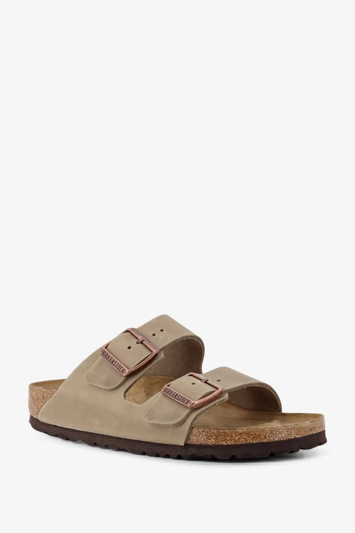 Birkenstock women’s arizona suede sandals in beige with rose gold buckles and cork footbed for casual wear