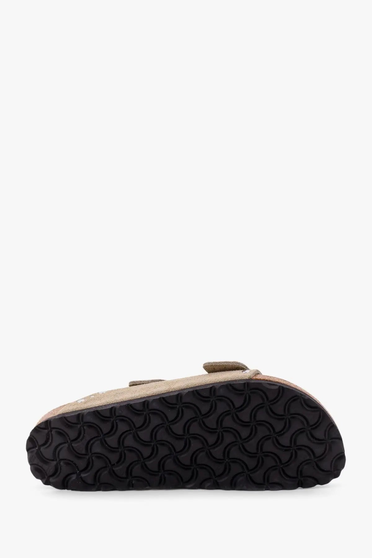 Beige suede birkenstock women’s arizona clog with black rubber sole featuring distinctive wavy pattern