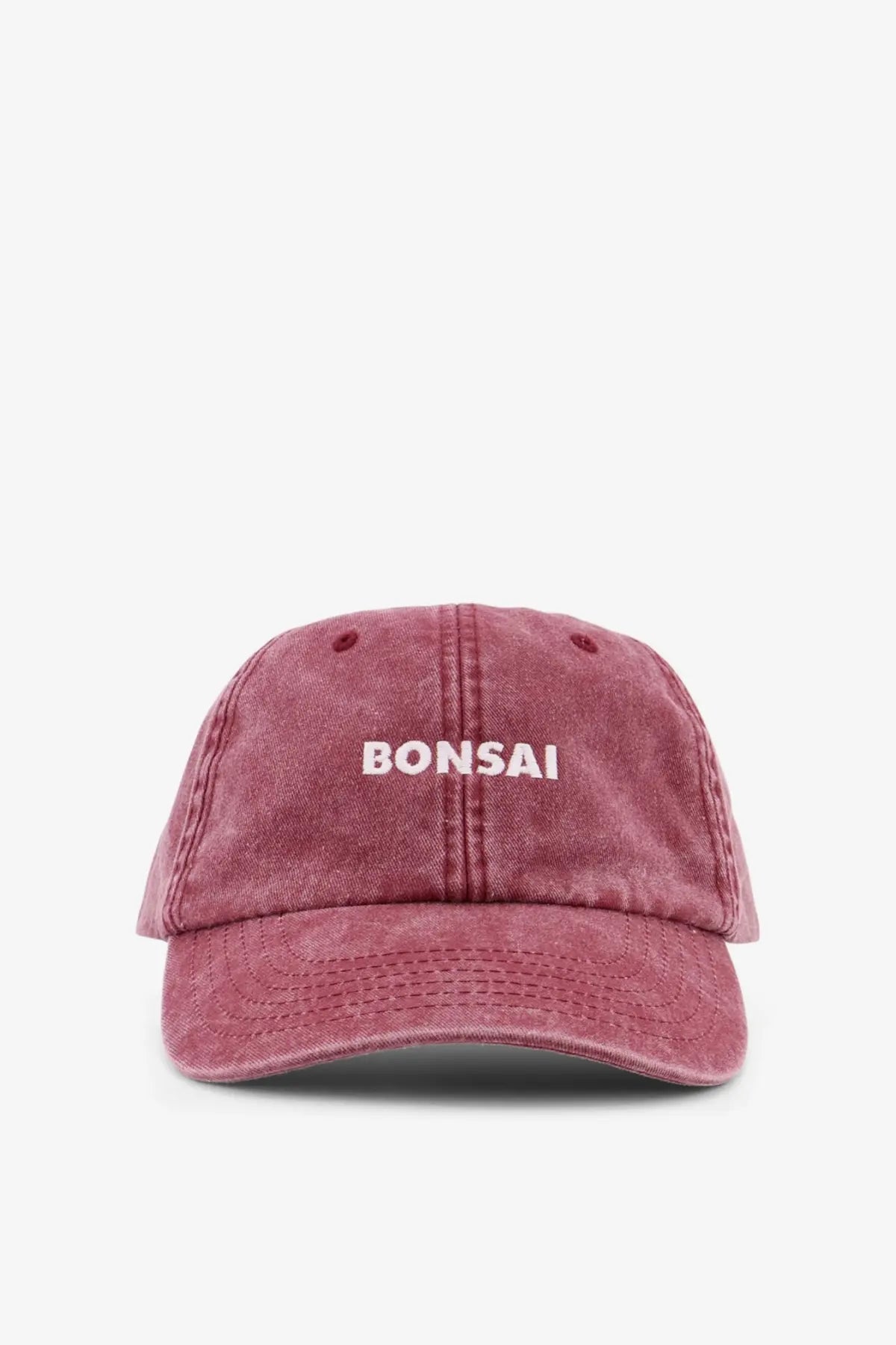Bonsai men’s vintage cotton baseball hat in dusty rose with white bonsai embroidery on the front and worn denim texture