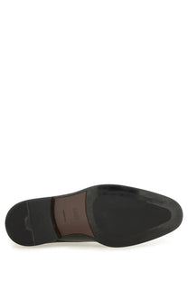 Black leather sole of boss men’s leather derby loafer with brown emma branded insole visible inside