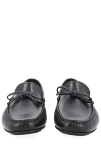 BOSS men’s moccasin black leather loafers with polished finish and matching bow ties for formal occasions