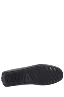 Black rubber sole with textured tread pattern and embossed logo on the underside of boss men’s moccasin black