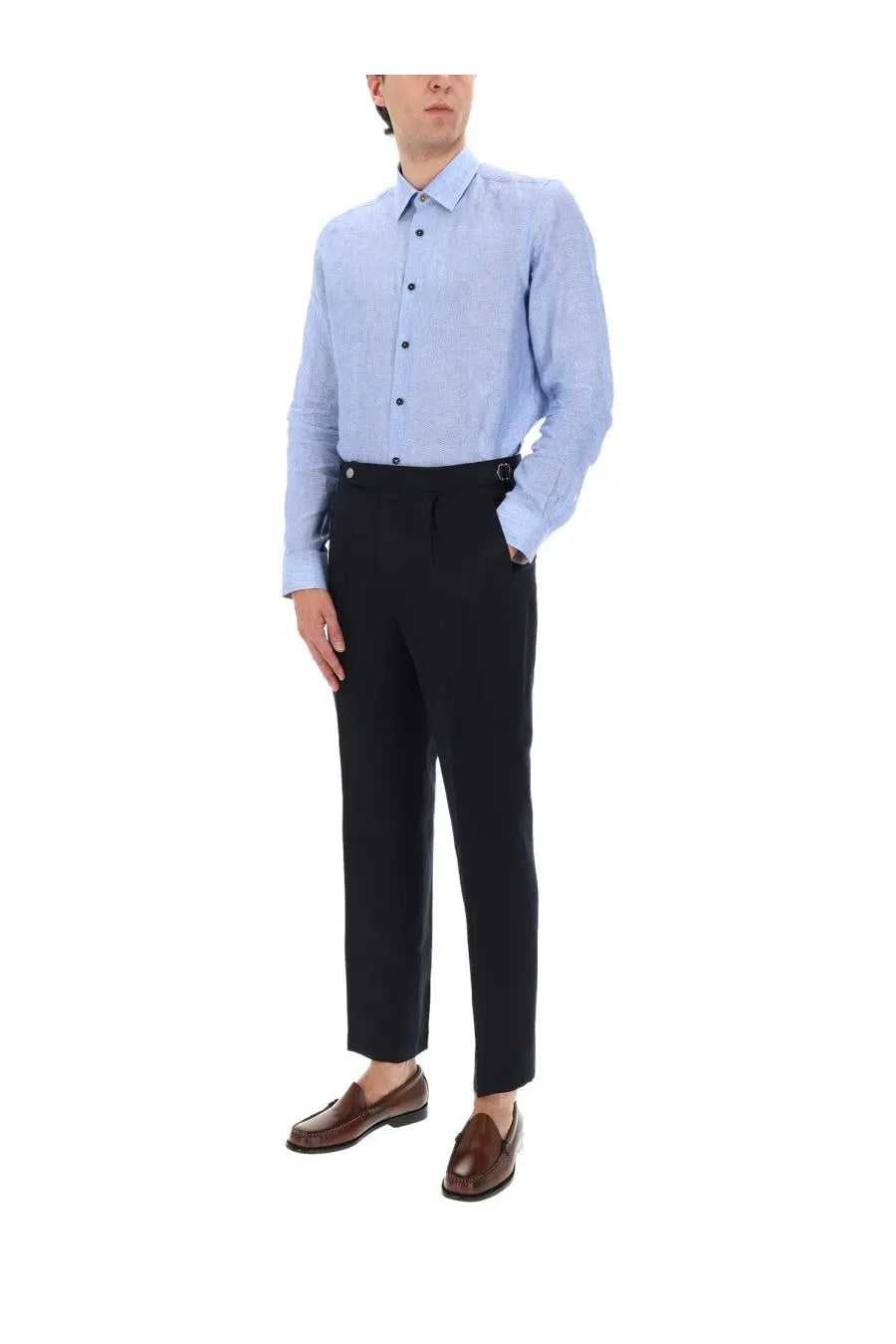 Light blue textured cotton button-down shirt paired with black trousers and brown leather loafers for men
