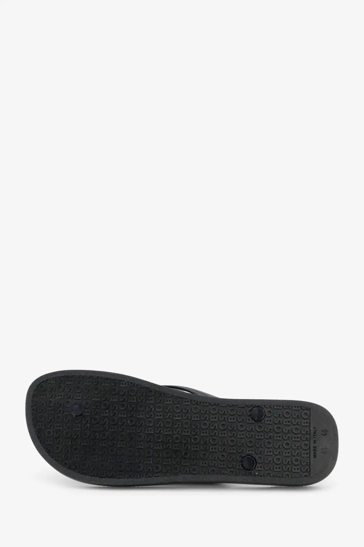 BOSS men’s black rubber flip flop sandal with textured sole featuring repeating letter patterns and heel indentations