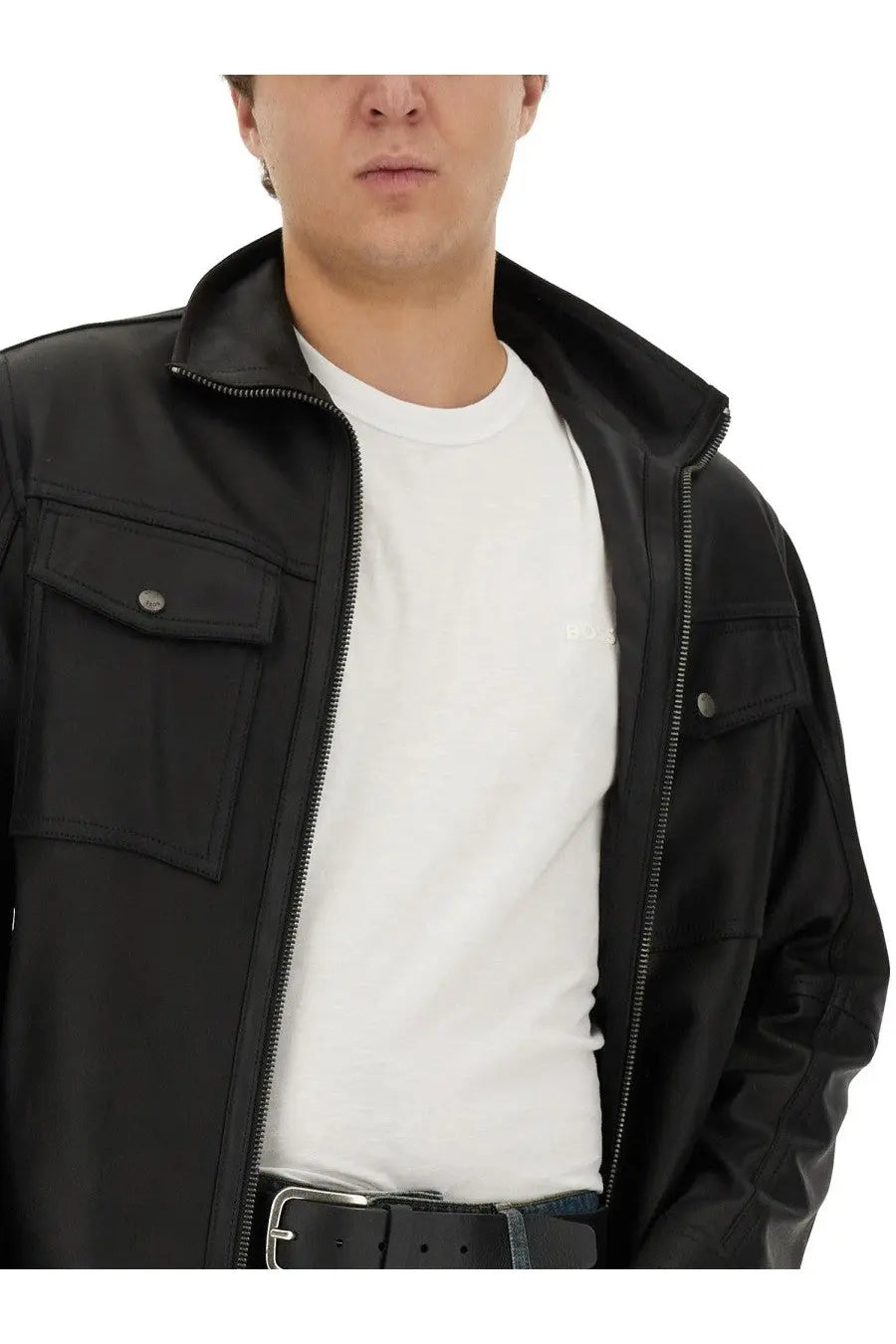 Black leather jacket with silver zippers and buttoned flap pockets paired with boss men’s white cotton shirt