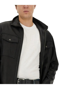 Black leather jacket with silver zippers and buttoned flap pockets paired with boss men’s white cotton shirt