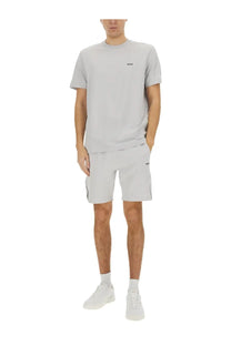 Light gray hugo boss short-sleeved t-shirt with subtle black logo paired with technical fabric bermuda shorts gray