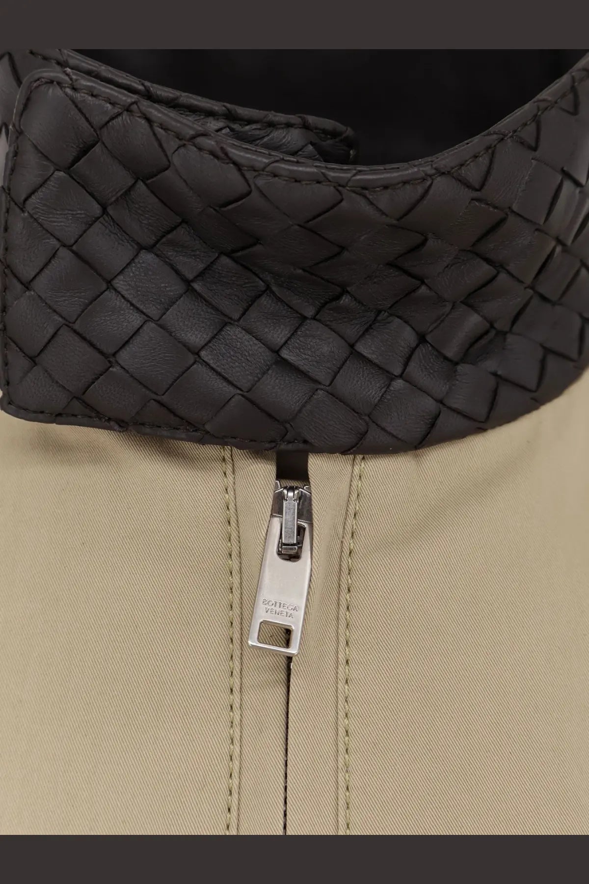 Black woven leather collar with silver zipper pull on Bottega Veneta jacket