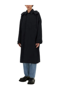 Bottega Veneta men’s blue hooded trench coat featuring a black trench coat with structured collar and buttoned cuffs